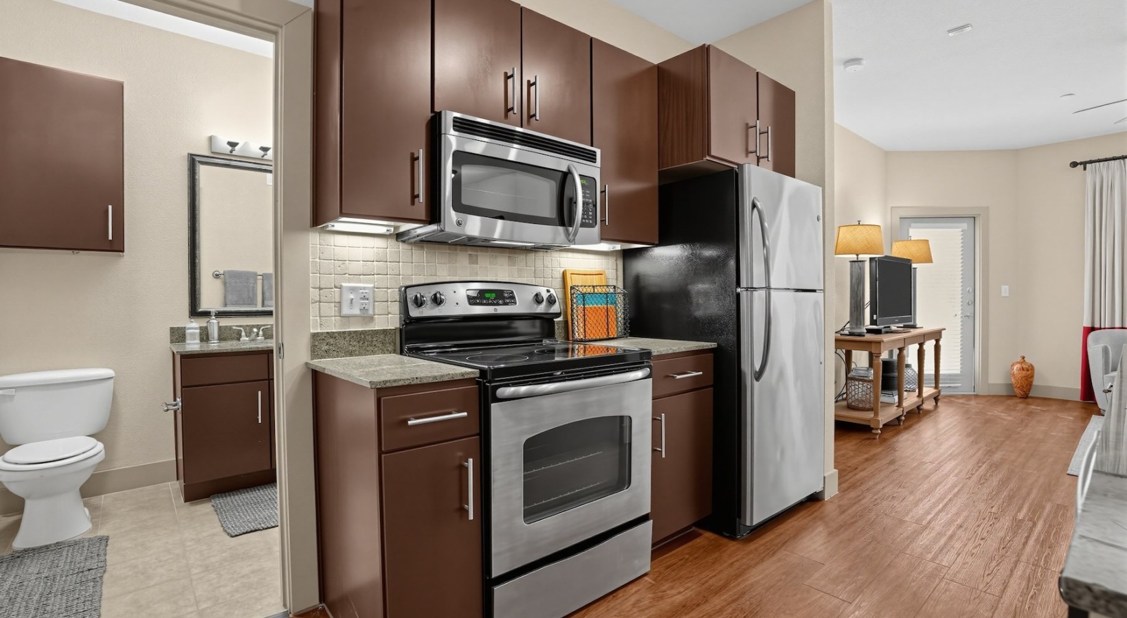 a kitchen with wood cabinets